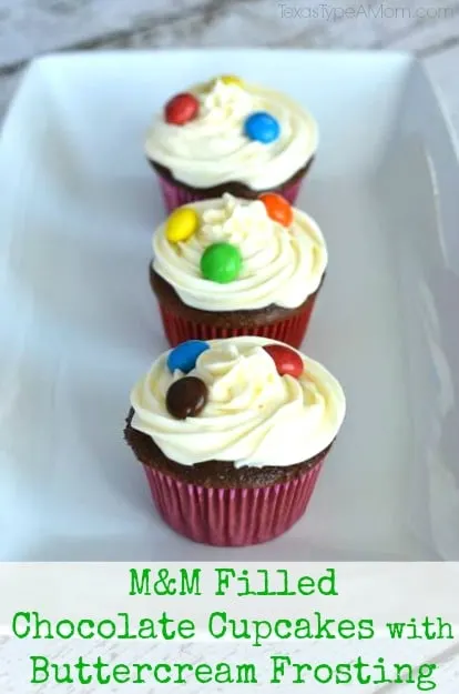 M&M Filled Chocolate Cupcakes with Buttercream Frosting Topped with M&Ms #shop #BakingIdeas #cbias