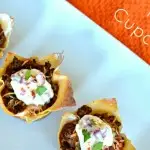 This savory, bite-sized appetizer Taco Cupcakes recipe makes the perfect appetizer for football season or a main dish for any occasion. All the flavors you love from tacos made wrapped in wonton wrappers for an easy to eat appetizer. #tacos #tacocupcakes #tacorecipes #beefrecipes #groundbeefrecipes #kidfriendlyrecipes #appetizers #appetizerrecipes #texmex #cincodemayo #wontonwrappers