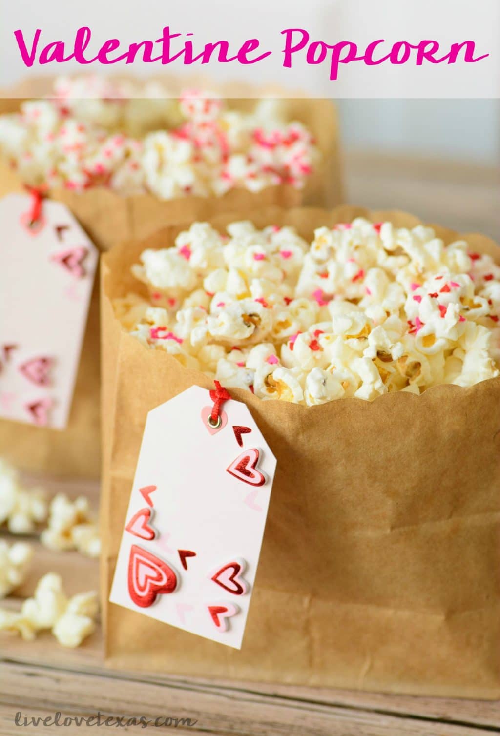 This Valentine's Day snack idea is the perfect combination of crunchy and sweet. This Confetti White Chocolate Popcorn recipe is so cute and easy which makes it a no-brainer for any Valentine's Day snacks for school or snacks for kids! #valentinesday #valentinesdayfood #valentinesdayrecipes #valentinesdaysnacks #valentinesdaypopcorn #valentinesdaytreats #valentinesdayideas #snacks #snacksforkids #desserts #snackmix #valentine #snacksforschool