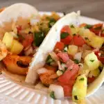 This Easy Spicy Shrimp Tacos Recipe with Pineapple Pico De Gallo has everything you need for the perfect seafood supper!
