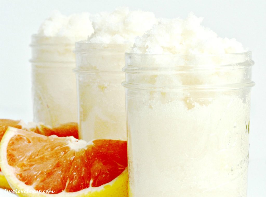 diy grapefruit sugar scrub in jars with fresh pink grapefruit