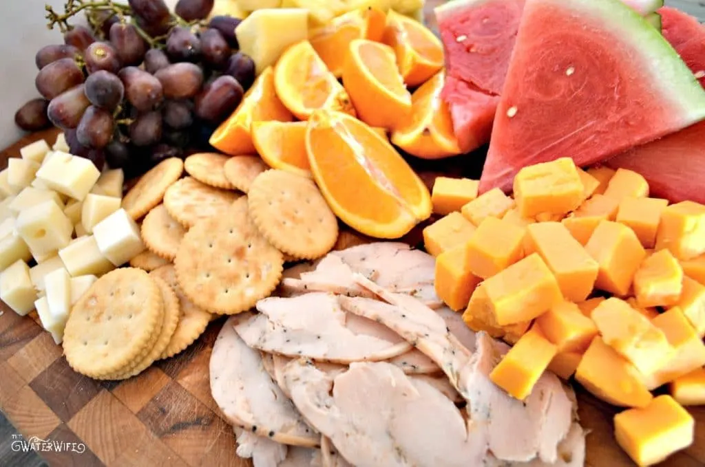 Fresh ingredients for the perfect summer appetizer trey with fresh fruits, cheeses and meats for any summer outing! 