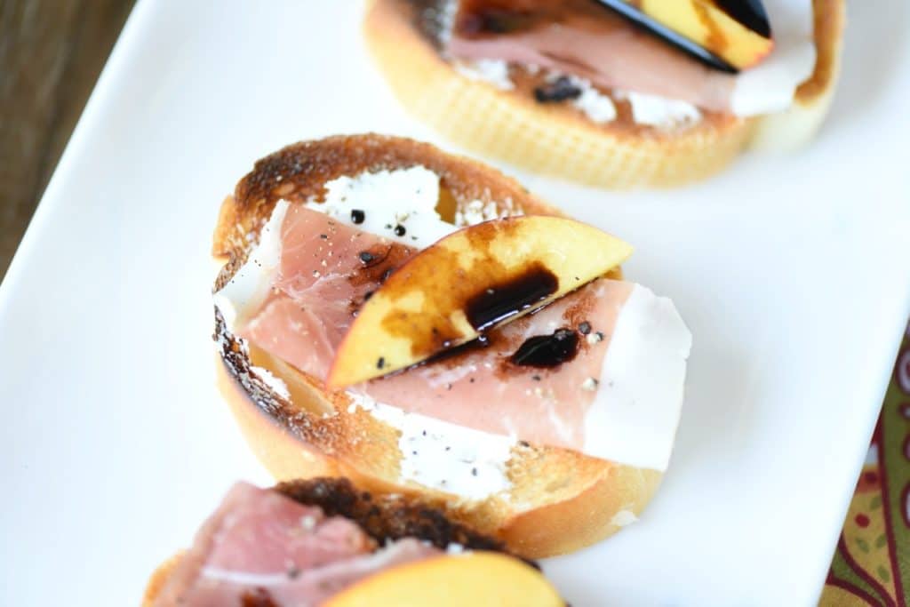 This Easy Crostini recipe with Goat Cheese Prosciutto and Peaches is the perfect appetizer for summer entertaining! 