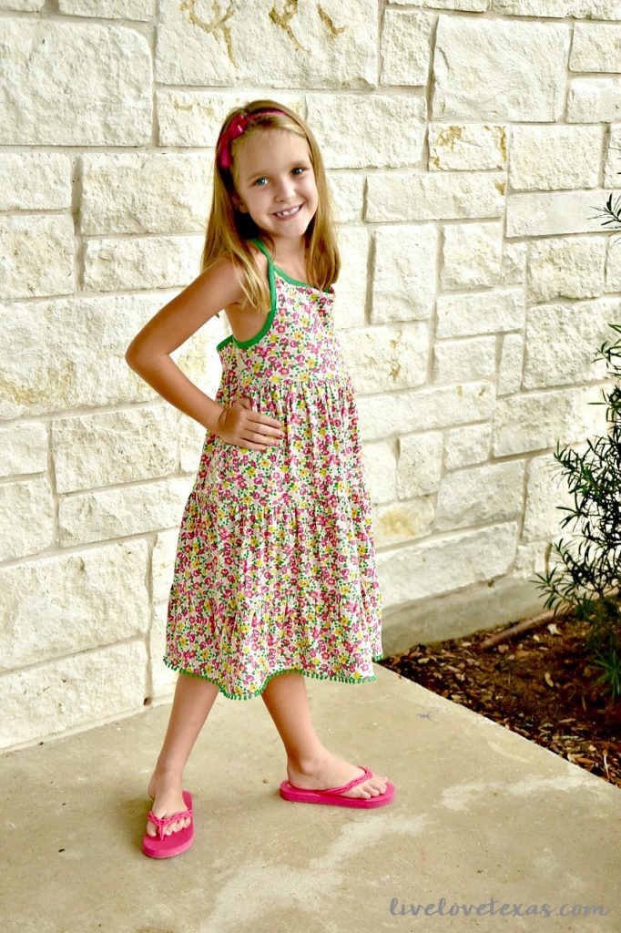 7 year old wearing Mini Boden Floral Dress