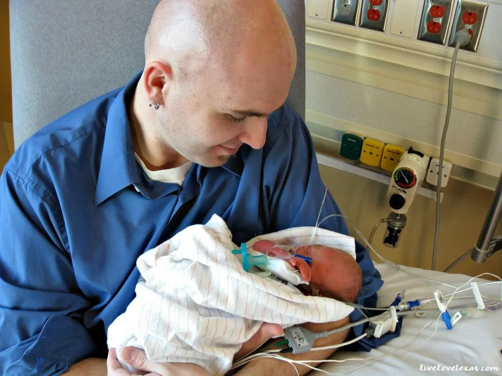 father-holding-baby-in-nicu