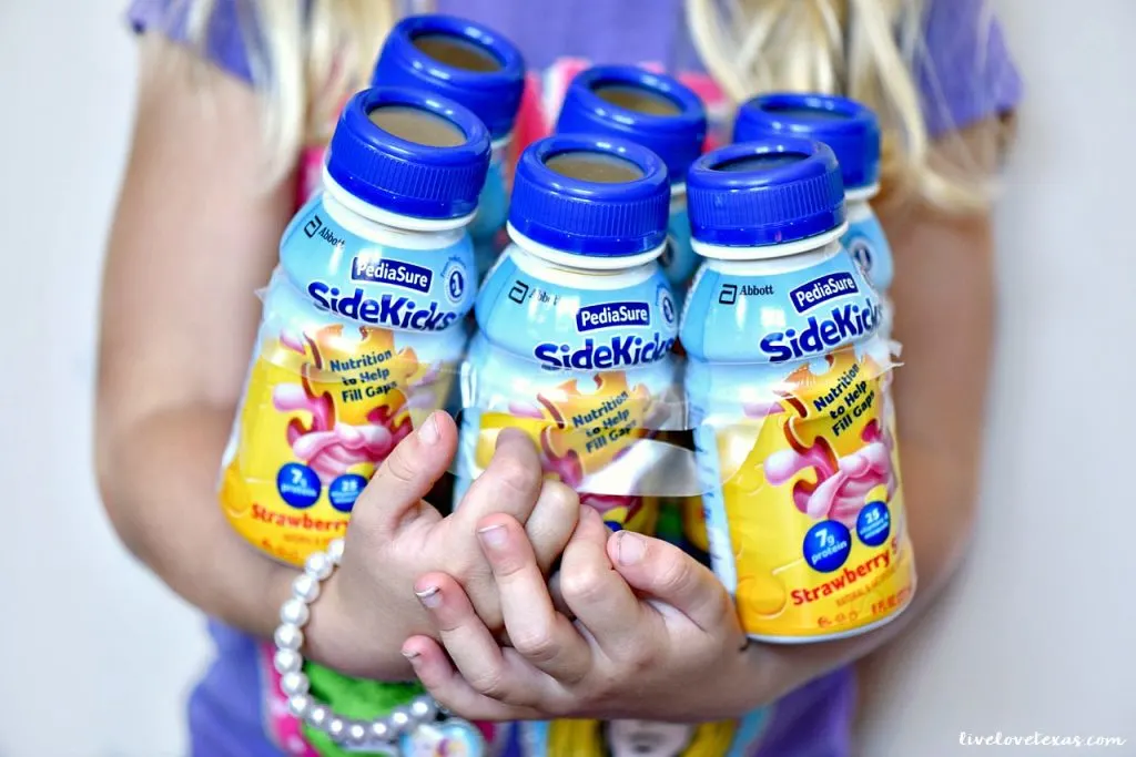 holding-6-pack-pediasure-sidekicks