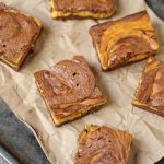 Three of your favorite dessert recipes collide in an explosion of harmonious flavors in this pumpkin cheesecake brownies recipe!