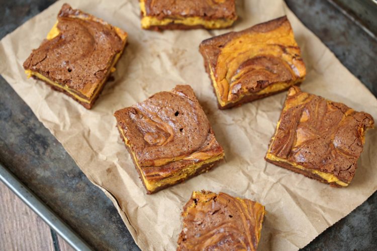 Three of your favorite dessert recipes collide in an explosion of harmonious flavors in this pumpkin cheesecake brownies recipe! #livelovetexas #pumpkin #pumpkinrecipes #pumpkindesserts #pumpkinrecipe #pumpkinbrownies #cheesecake #brownies #recipe #recipes #falldesserts #fallfood #thanksgivingrecipe #thanksgivingdessert #dessertrecipe #desserts