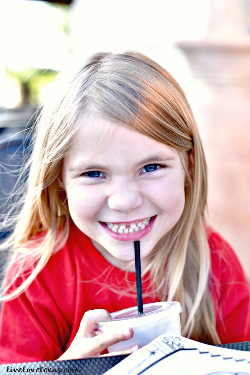 Girl drinking at Cheddar's Scratch Kitchen review.