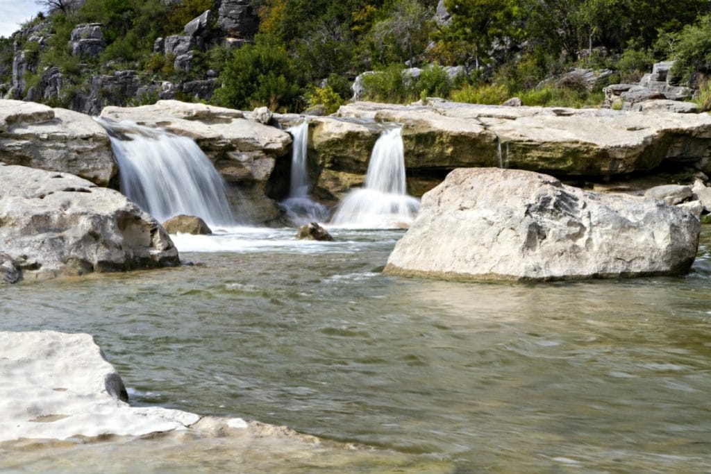 You don't have to travel far to cool down this summer with this collection of the 9 Best Central Texas Waterfalls located within an hour of the greater Austin area. City parks, state parks, and everything in between!