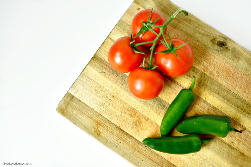 Ditch the store-bought salsa and make your own with this Easy Homemade Salsa Recipe with Fresh Tomatoes & Peppers. It's fast and simple to make to make and tastes great as a topping or with chips!