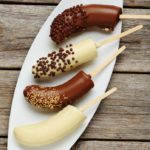 Making a fun dessert doesn't have to be hard. This easy to make Chocolate Covered Frozen Bananas Recipe uses ingredients you likely already have and comes together in just 30 minutes!