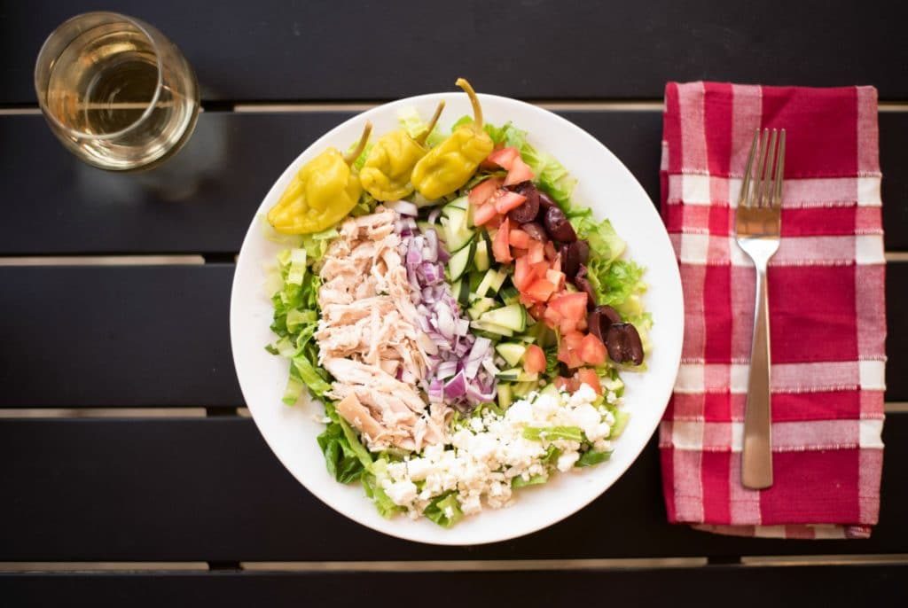 During the summer, you're busy and don't want to be a slave to the stove. This Easy Greek Salad with Rotisserie Chicken recipe is perfect for hot summer nights and is light, flavorful, and super simple to make for a quick dinner! 
