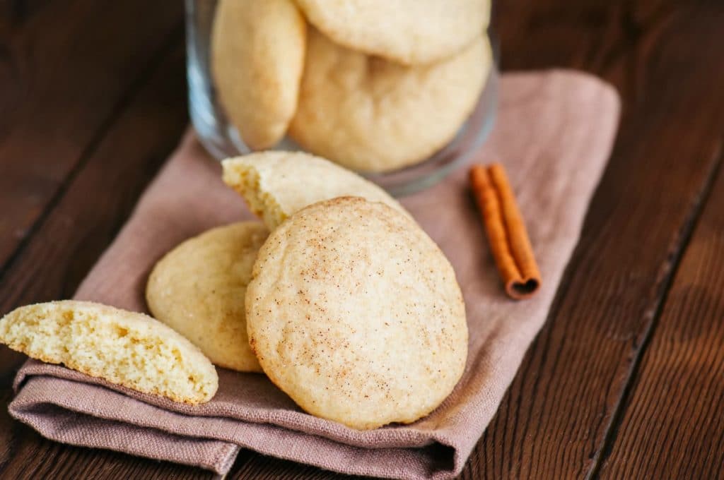 These super soft snickerdoodle cookies are the perfect recipe for your Christmas cookie exchange or just dessert. The secret to how to make soft snickerdoodle cookies is in chilling the dough. This chewy sugar cookie recipe is just the right balance of cinnamon and sugar.