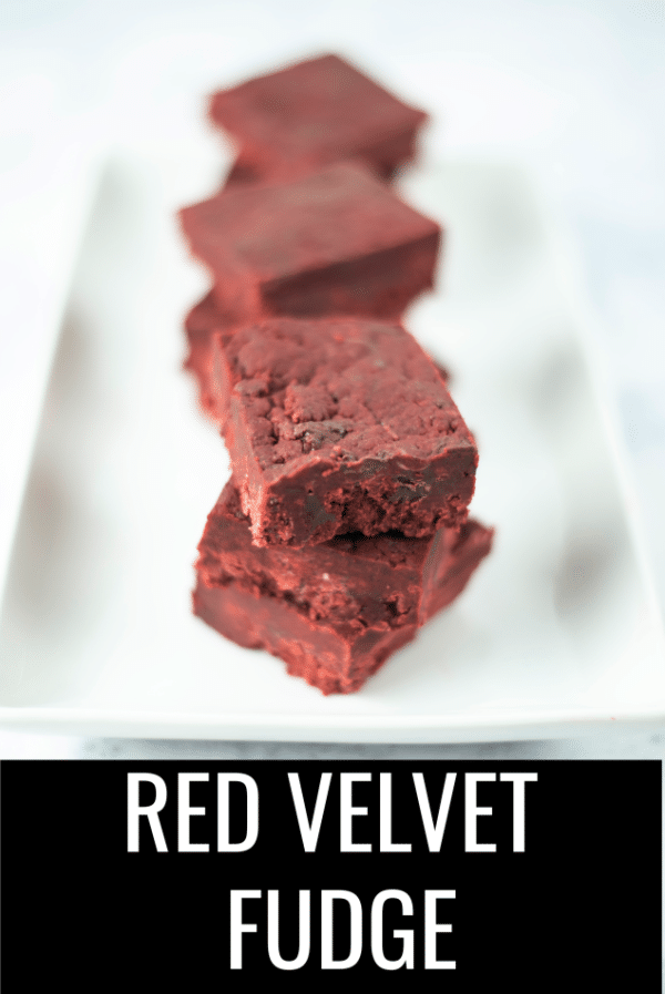You can make this easy red velvet fudge recipe in the amount of time it takes to watch a movie. It's a wonderful little kid friendly dessert to do with your family before a movie night. #christmassweetsweek #sponsored #redvelvetfudge #redvelvet #redvelvetrecipes #fudgerecipes #christmasrecipes #fudge #desserts