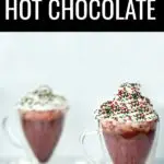 Your entire kitchen will smell like winter heaven when you serve this&nbsp;red velvet hot chocolate! This is an easy holiday drink recipe but served in&nbsp;a clear glass mug makes a stunning presentation. #sponsored #redvelvet #hotchocolate #hotcocoa #drinkrecipes #hotdrinks #holidaydrinks #holidayrecipes #christmasrecipes #redvelvethotchocolate #redvelvetrecipes