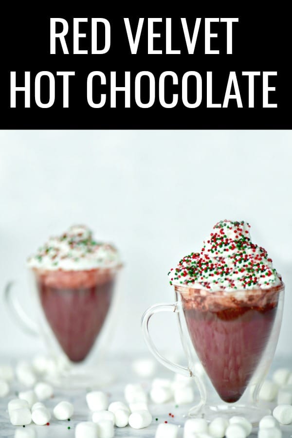 Your entire kitchen will smell like winter heaven when you serve this red velvet hot chocolate! This is an easy holiday drink recipe but served in a clear glass mug makes a stunning presentation. #sponsored #christmassweetsweek #redvelvet #hotchocolate #hotcocoa #drinkrecipes #hotdrinks #holidaydrinks #holidayrecipes #christmasrecipes #redvelvethotchocolate #redvelvetrecipes