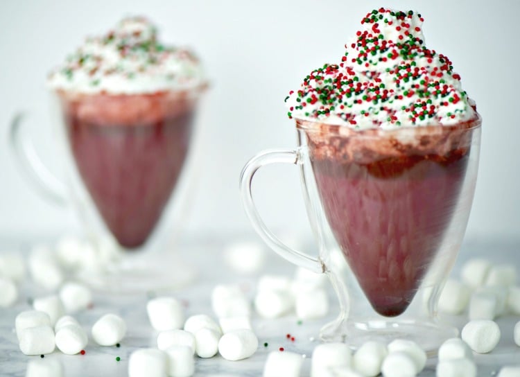 Your entire kitchen will smell like winter heaven when you serve this red velvet hot chocolate! This is an easy holiday drink recipe but served in a clear glass mug makes a stunning presentation.