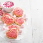 Valentines day heart shaped cookies with pink sprinkles