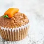 Kid friendly carrot muffin with carrot icing on top.