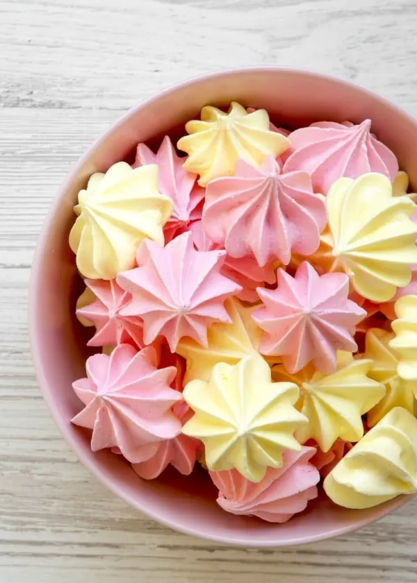 Meringue drop cookies in a pink bowl.