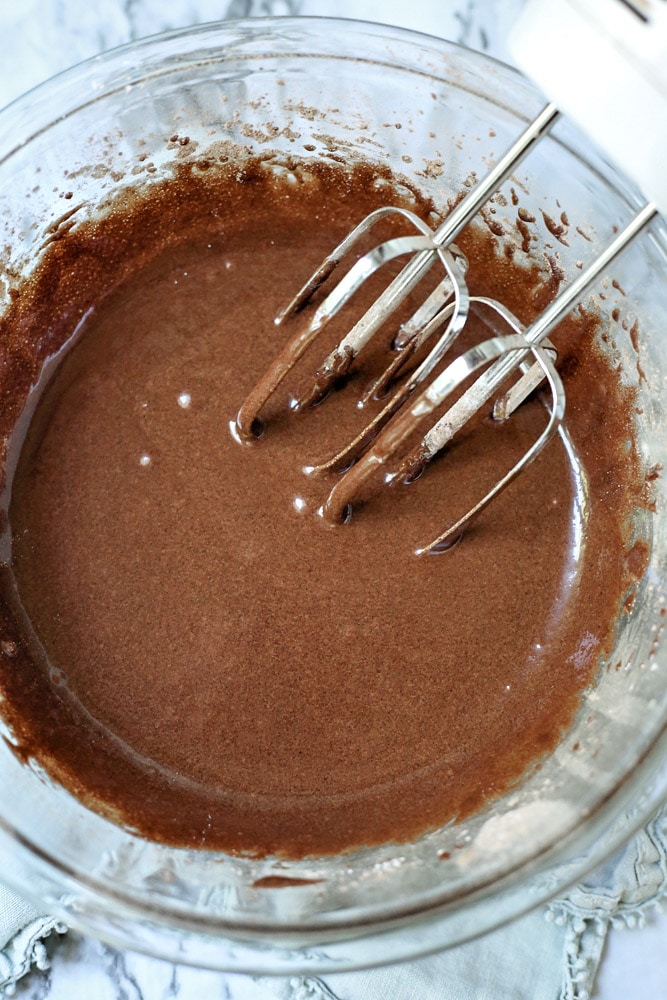 How to make brownies. Brownie batter in bowl with mixer.
