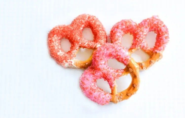 Sprinkle covered pretzels for Valentine's Day snacks.