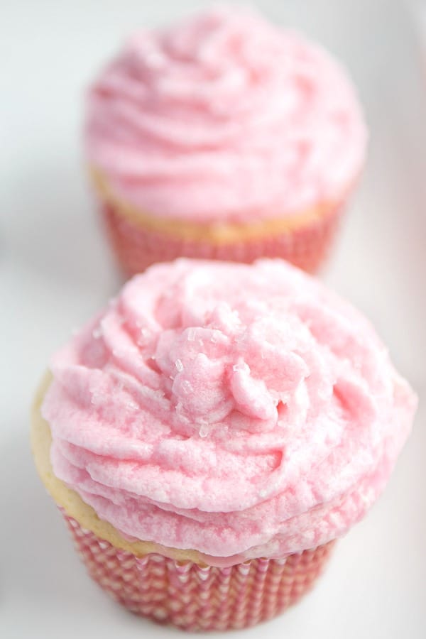 Frosted Rosé wine cupcakes on plate topped with sugar