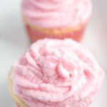 Frosted Rosé wine cupcakes on plate topped with sugar