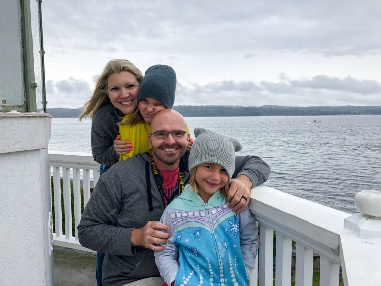 Family posing outside Seattle at the Mulkiteo Lighthouse.