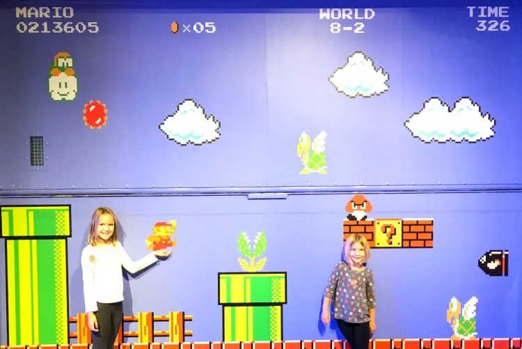 Two girls having fun in the Mopop Museum in Seattle, Washington.