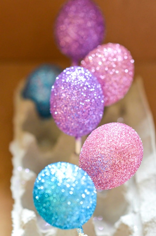 glittered eggs drying in egg carton