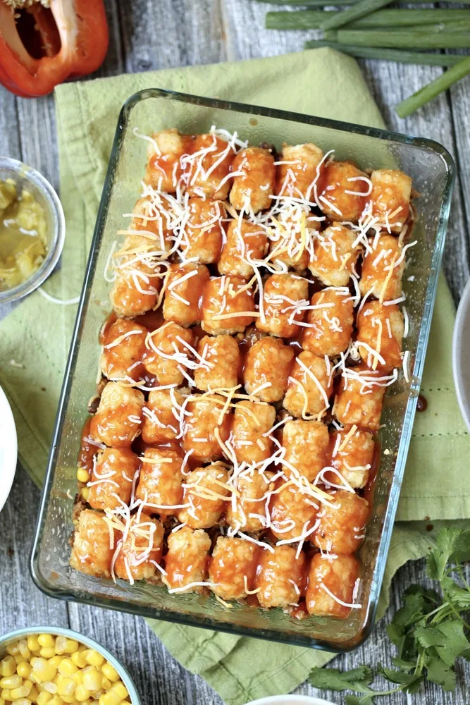 Single layer tater taco casserole recipe in baking dish.