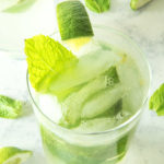 Fresh mojitos in glasses with fresh lime and mint leaves