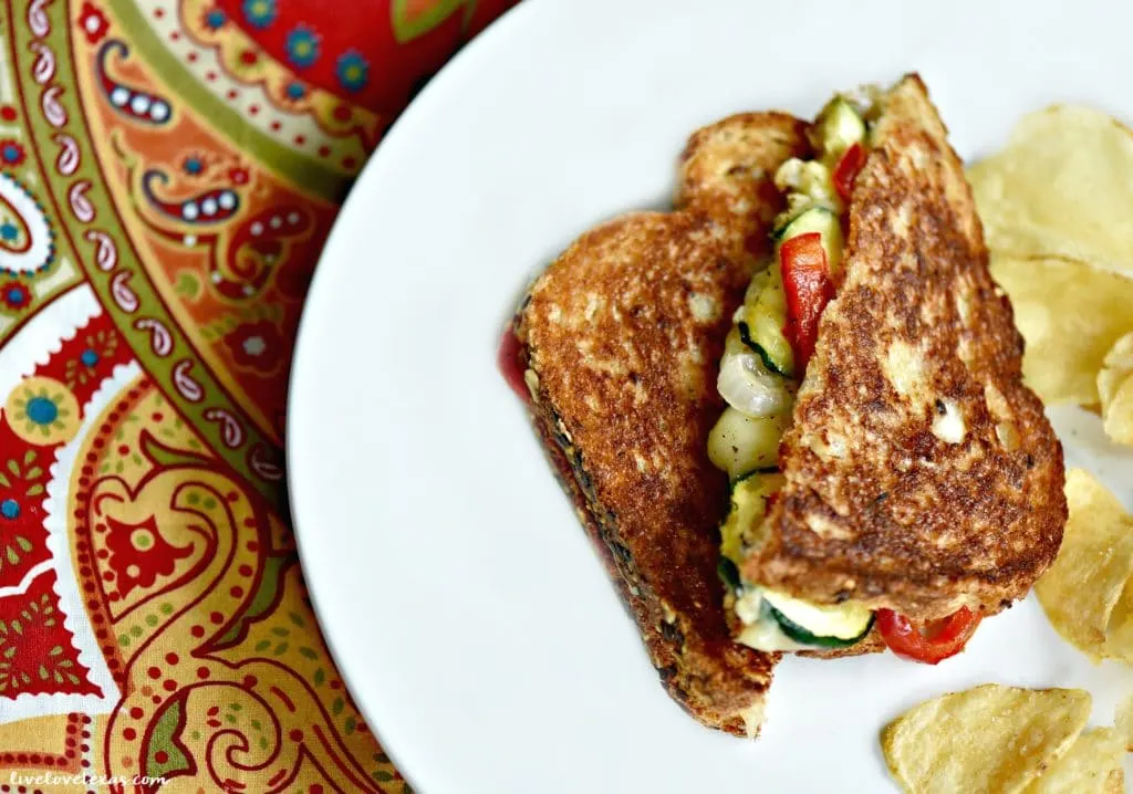 Crispy veggie filled grilled cheese sandwiches on plate