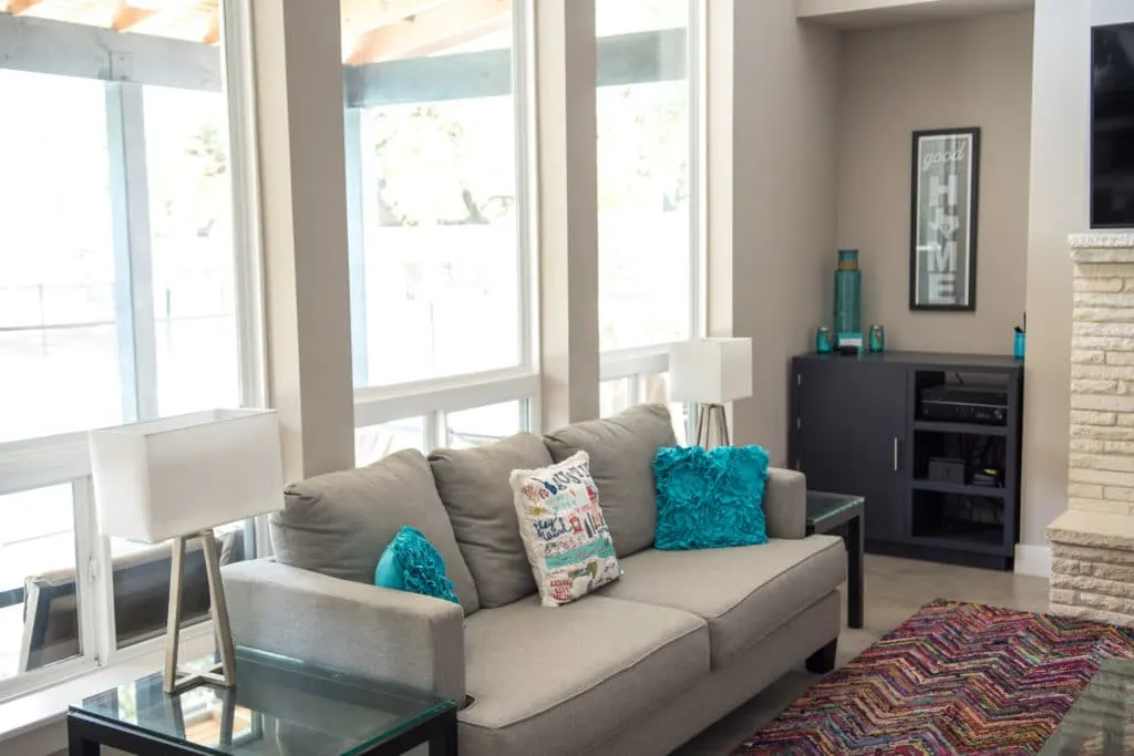 Modern living room with colorful touches in smart home.