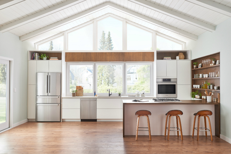 Counter depth stainless steel refrigerator in modern farmhouse kitchen