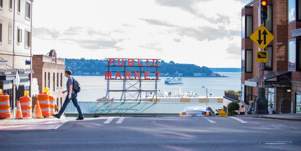 Seattle Public Market with ferry boat on bay in background