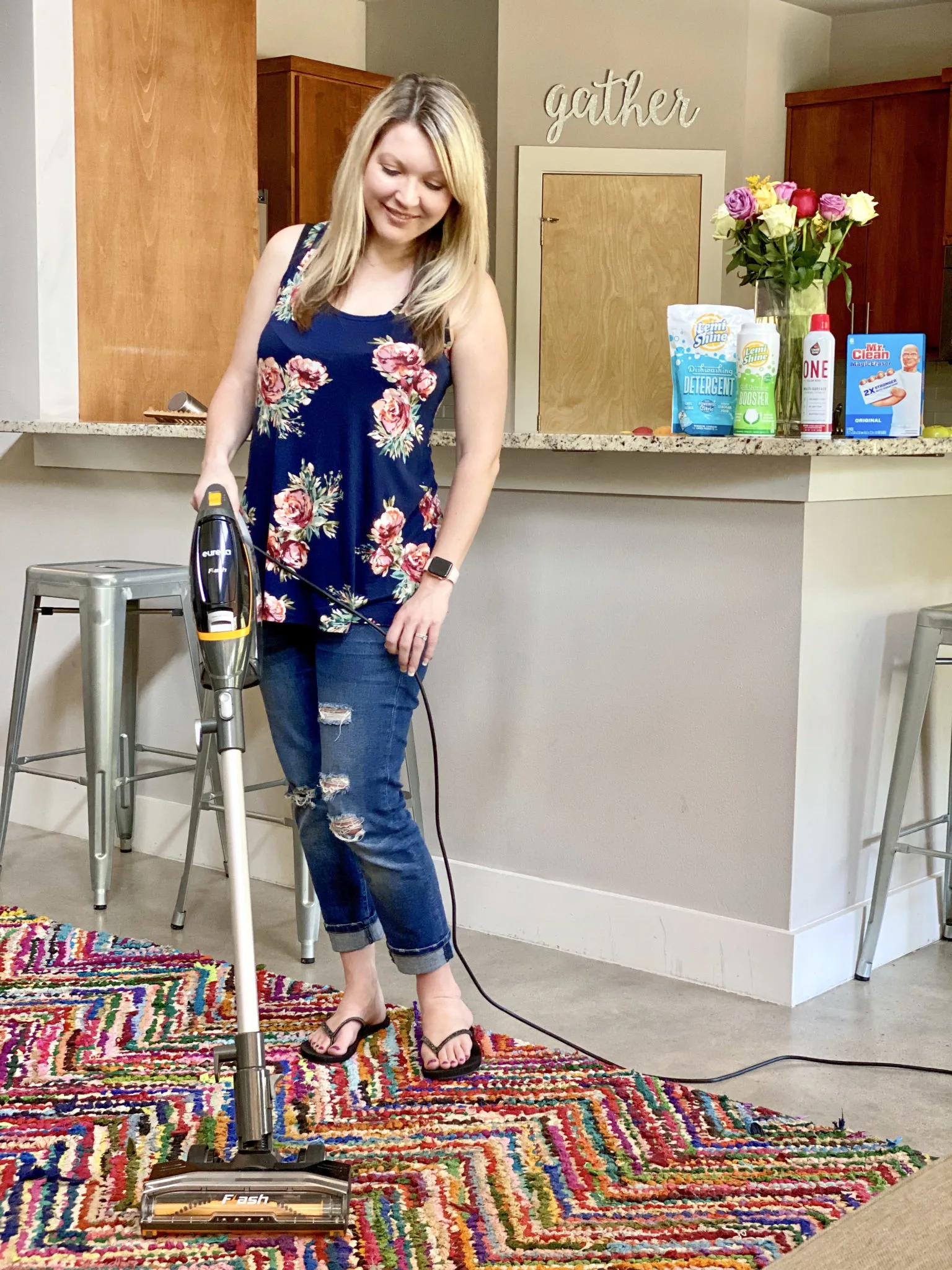 Using a lightweight Eureka Flash vacuum to rainbow rug.