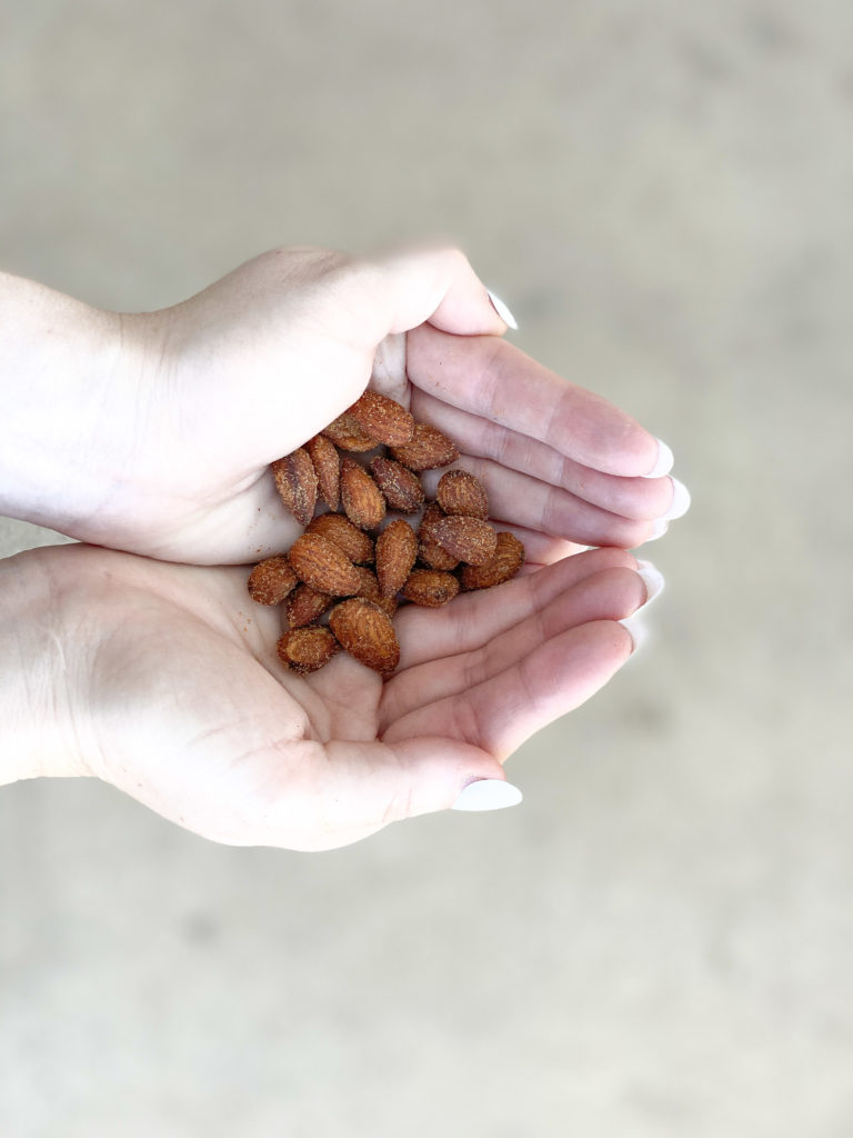 woman holding almonds
