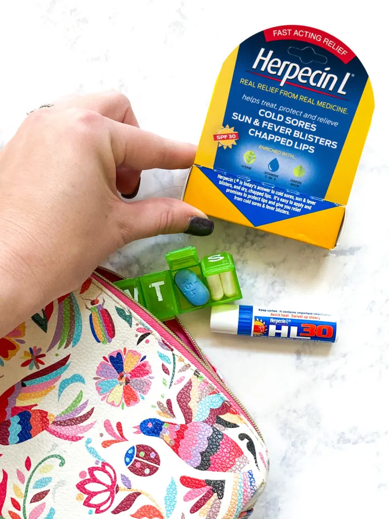 Fever blister remedies flat lay holding Herpecin L