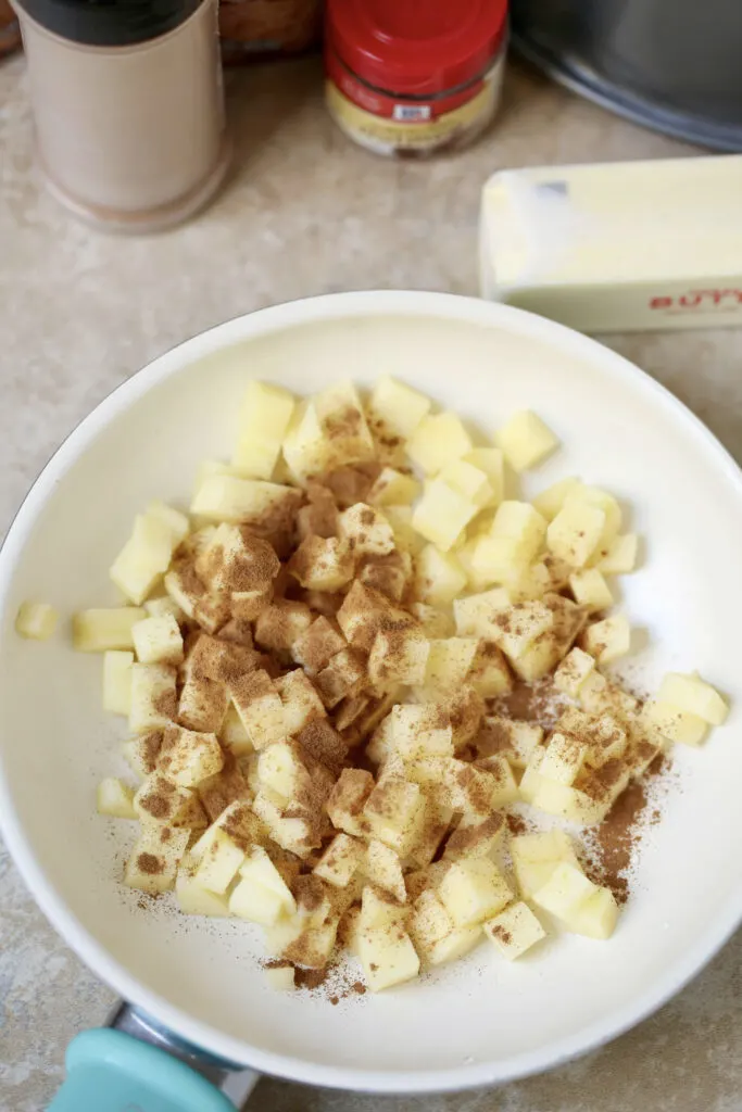 Don't stress over fall entertaining or deciding which breakfast or dessert recipe to make. Instead, try this easy monkey bread recipe with biscuits plus five other ingredients which come together to make Apple Cinnamon Monkey Bread! #applerecipes #monkeybreadrecipes #monkeybread #applecinnamonmonkeybread  #fallrecipes #christmasmorning #holidayrecipes #apple #applecinnamon #easyrecipes #easyrecipe #recipe #recipes #breakfastrecipes #brunchrecipes #fallfood #fallcooking #holidaybreakfast #holidaybrunch 
